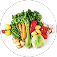 Array of colorful fruits and vegetables including celery, carrots, and tomatoes